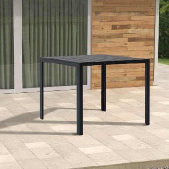 A black table with a glass top is sitting on a patio. AI generated content