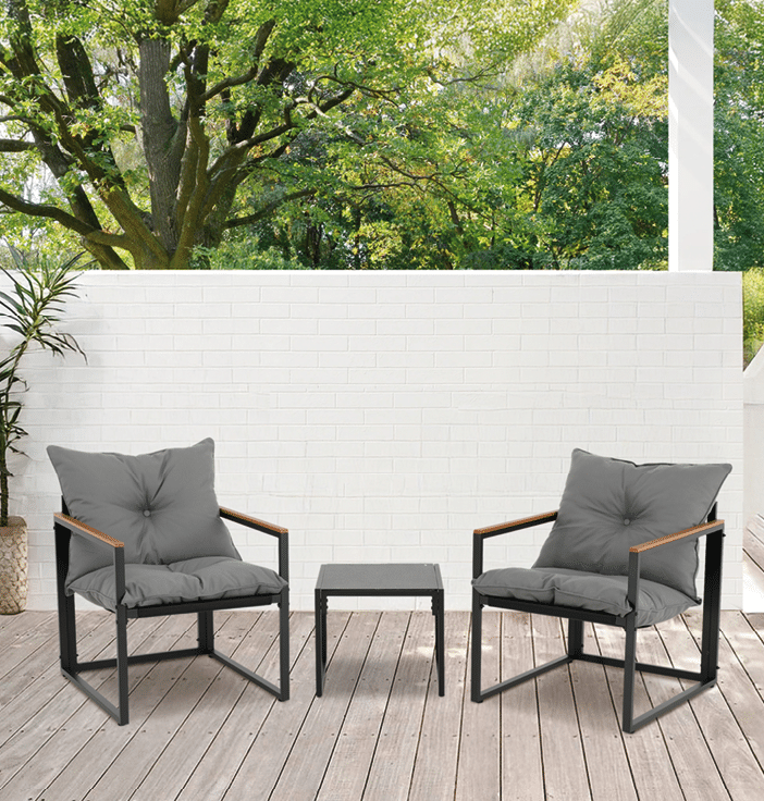 Two chairs are placed on a wooden deck, one on the left and one on the right. They are positioned facing each other, creating a comfortable conversation area. The chairs are made of wood and have cushions for added comfort. The deck is surrounded by a white wall, giving the space a clean and modern appearance. AI generated content