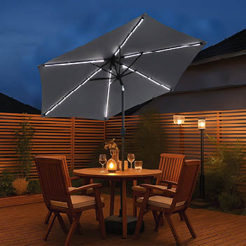 A patio table with four chairs, two of which are empty, and a wine glass on it. AI generated content