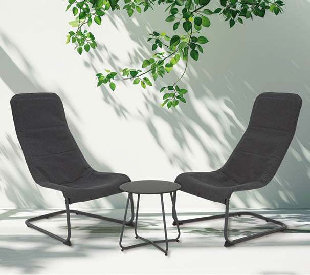 Two black chairs are placed in front of a wall with a green plant above them. AI generated content