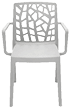 A white chair with a patterned backrest. AI generated content
