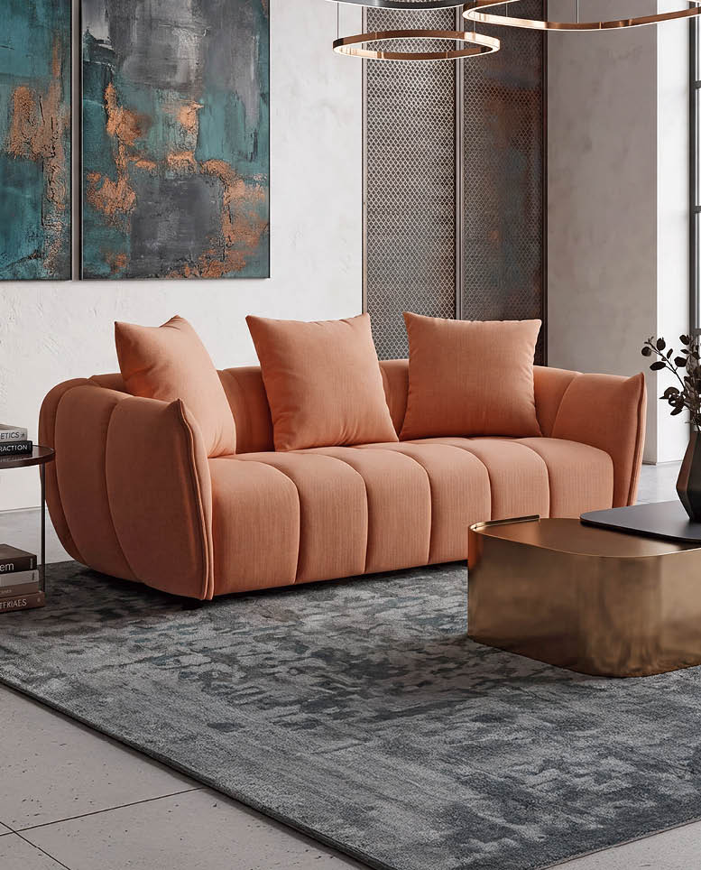 A large, tan couch with pillows on it is in a living room. AI generated content