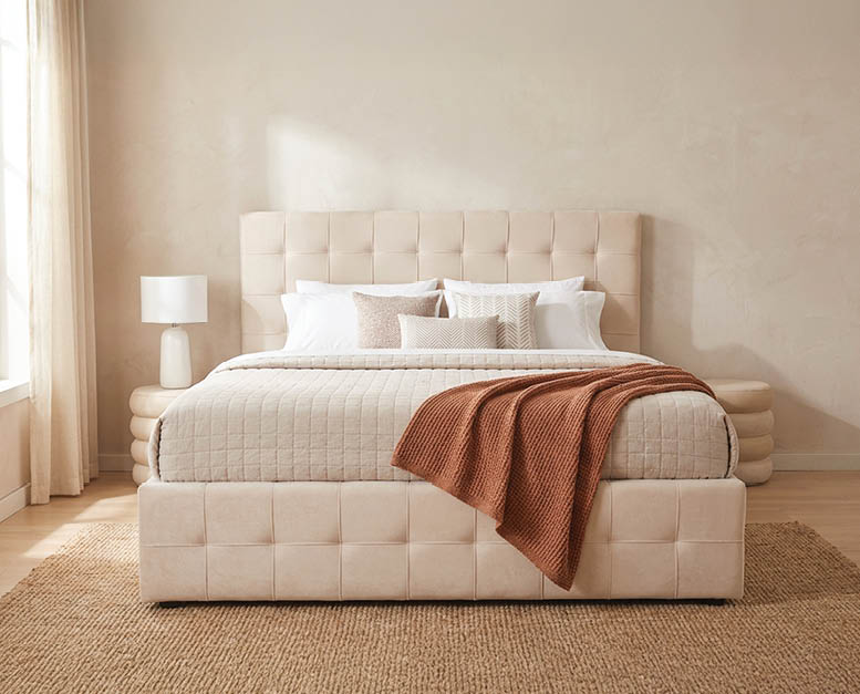 A bed with a white headboard and a brown blanket on it. AI generated content