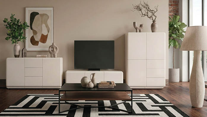 A living room with a flat screen TV, a coffee table, and a couch. A potted plant and a vase are also present in the room. AI generated content