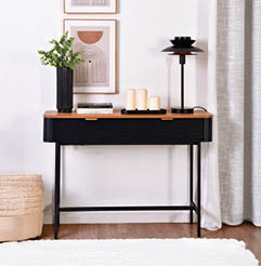 A black table with candles and a picture on it. AI generated content