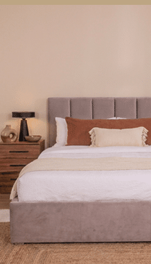 A bed with a white comforter and brown pillows. AI generated content