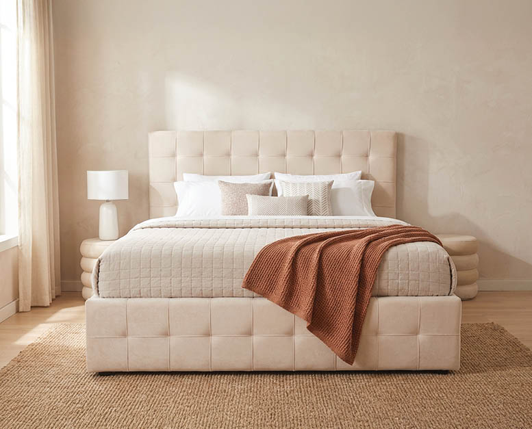 A bed with a white headboard and a brown blanket on it. AI generated content